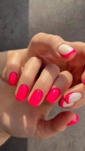 Short square neon hot pink nails and milky base with hot pink French tips for bright summer style