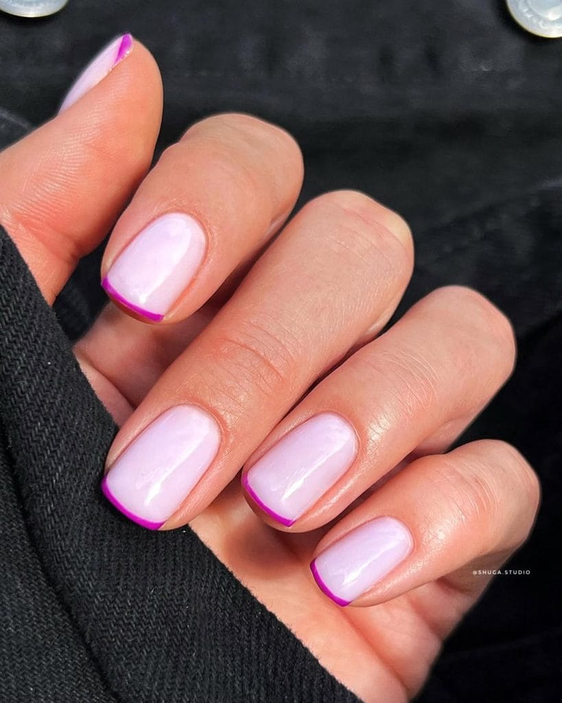 lassy short summer nails with pale lavender base and thin magenta French tips