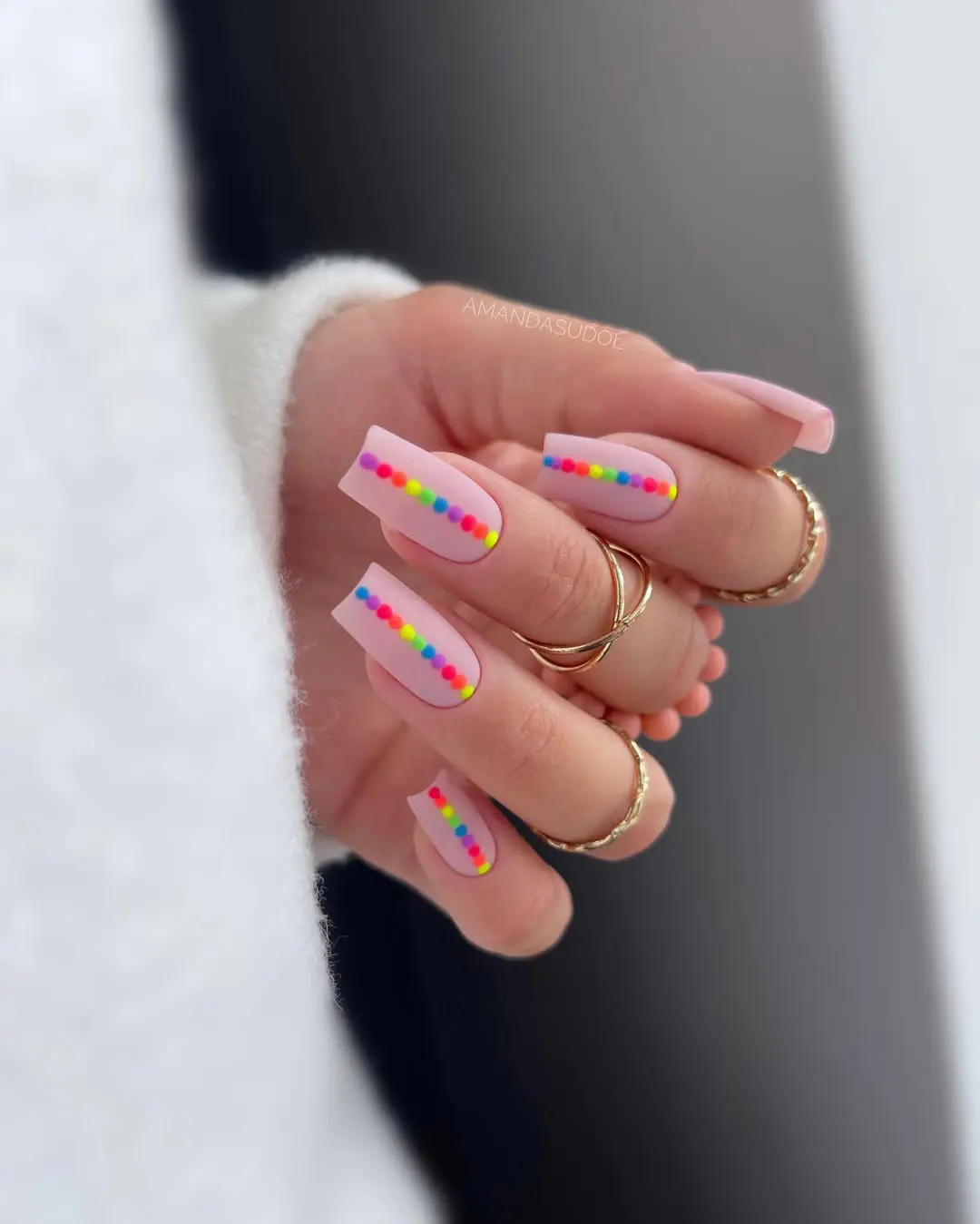 Tiny gold foil accents on nude nails