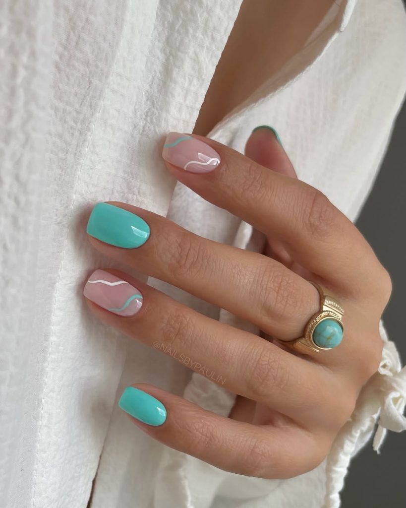 Classy June nails with square shape featuring turquoise solid color and pink base with wavy white and turquoise pattern
