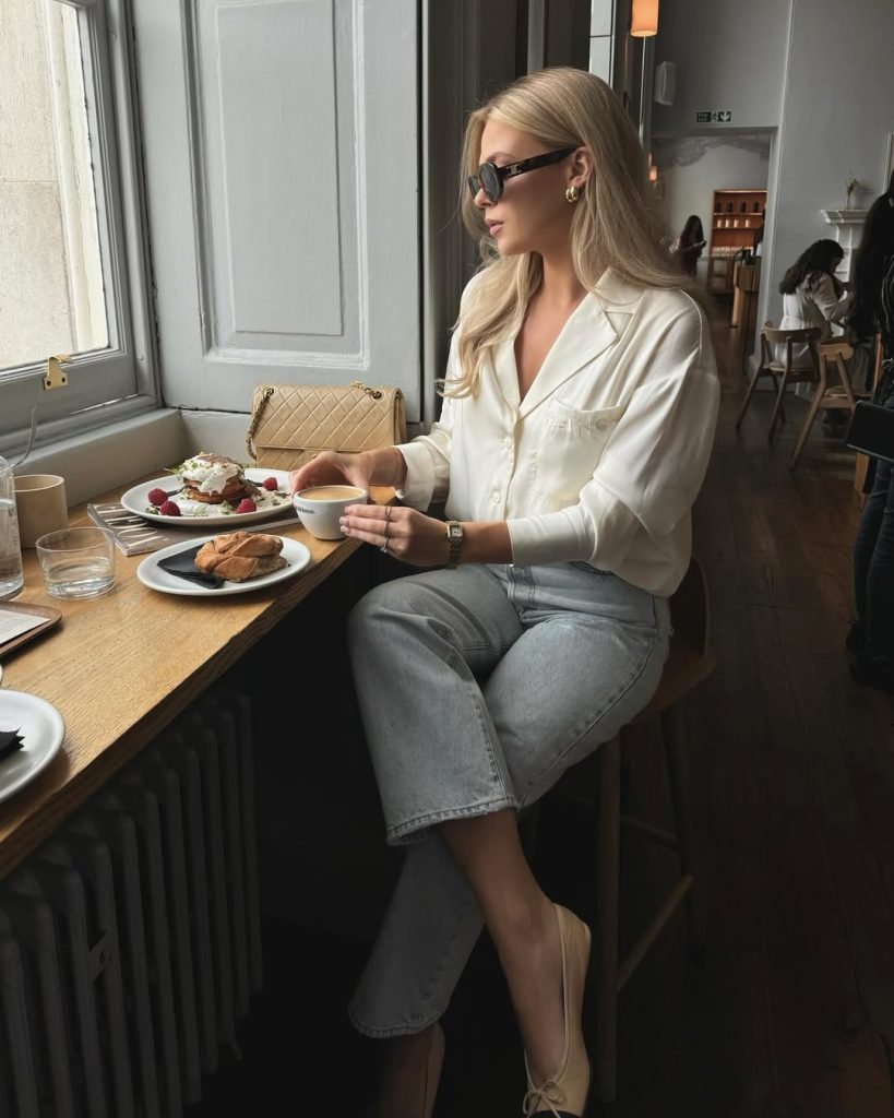 Old money summer outfit with cream silk button-up shirt, light wash wide-leg jeans, quilted beige designer handbag, dark sunglasses and cap-toe ballet flats
Old money summer outfit with cream silk button-up shirt, light wash wide-leg jeans, quilted beige designer handbag, dark sunglasses and cap-toe ballet flats
