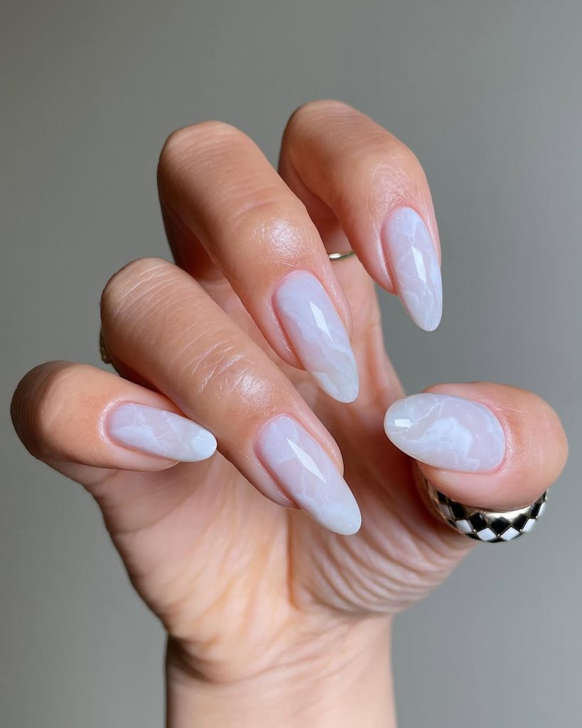 old money summer long almond nails with translucent white marble effect 