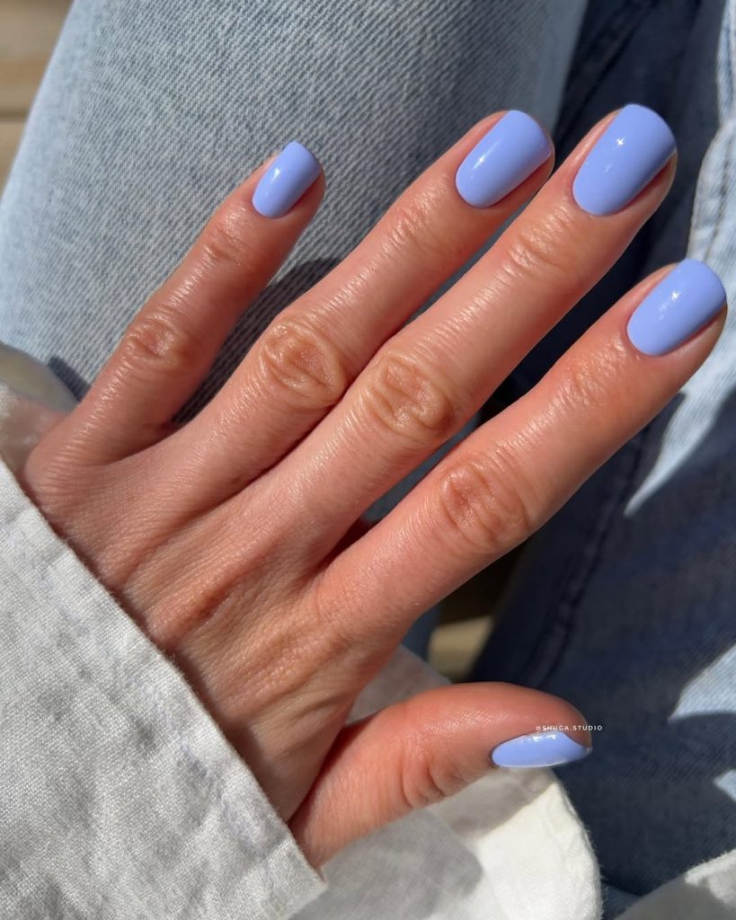 Short old money summer nails with glossy light periwinkle blue polish 