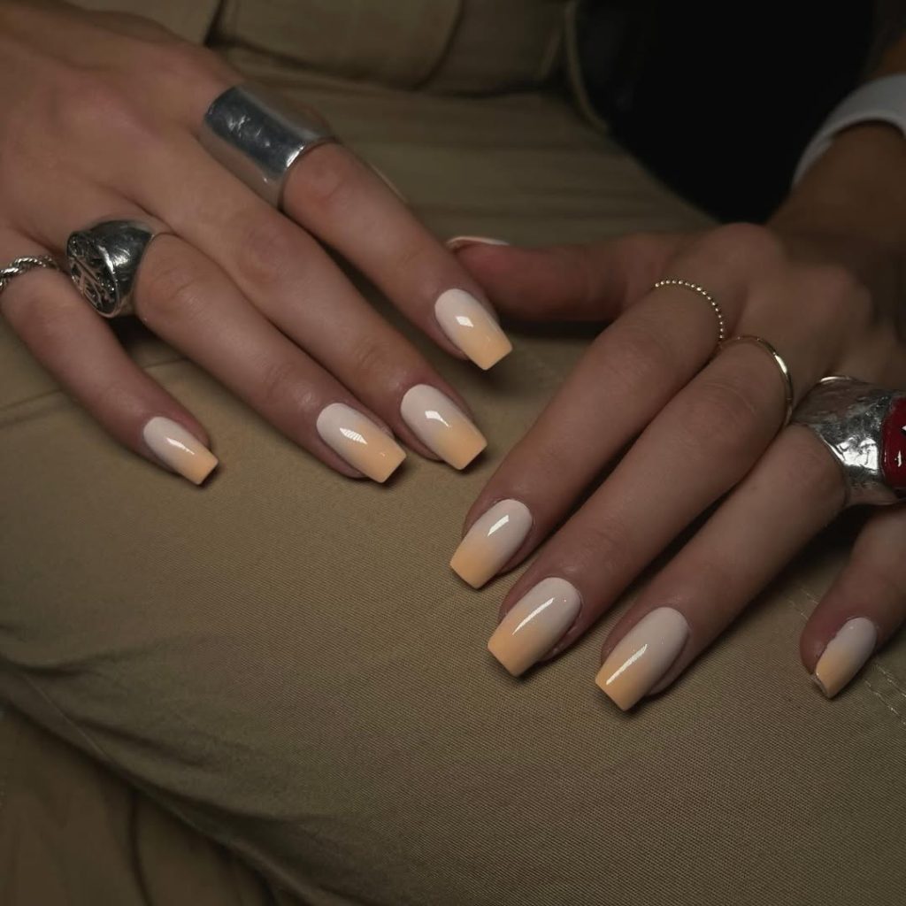 Classy June nails with square shape featuring cream to soft peach ombré gradient
