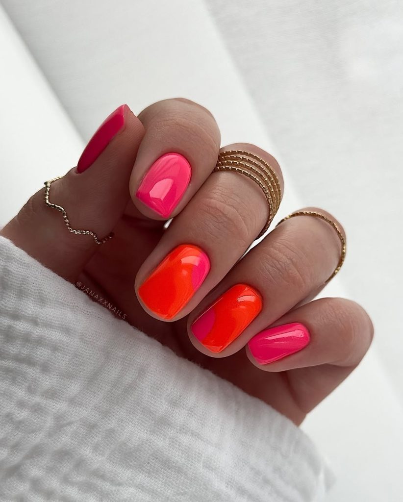Short square nails with hot pink and coral-orange color combinations for bold summer manicure
