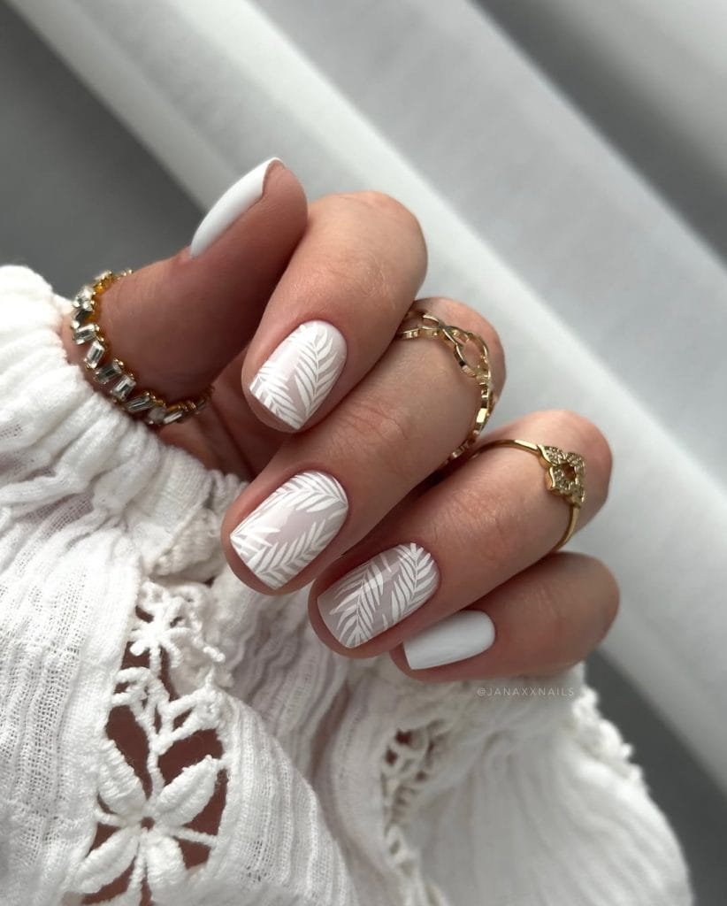 Short square vacation nails with white base and white palm leaf nail art design