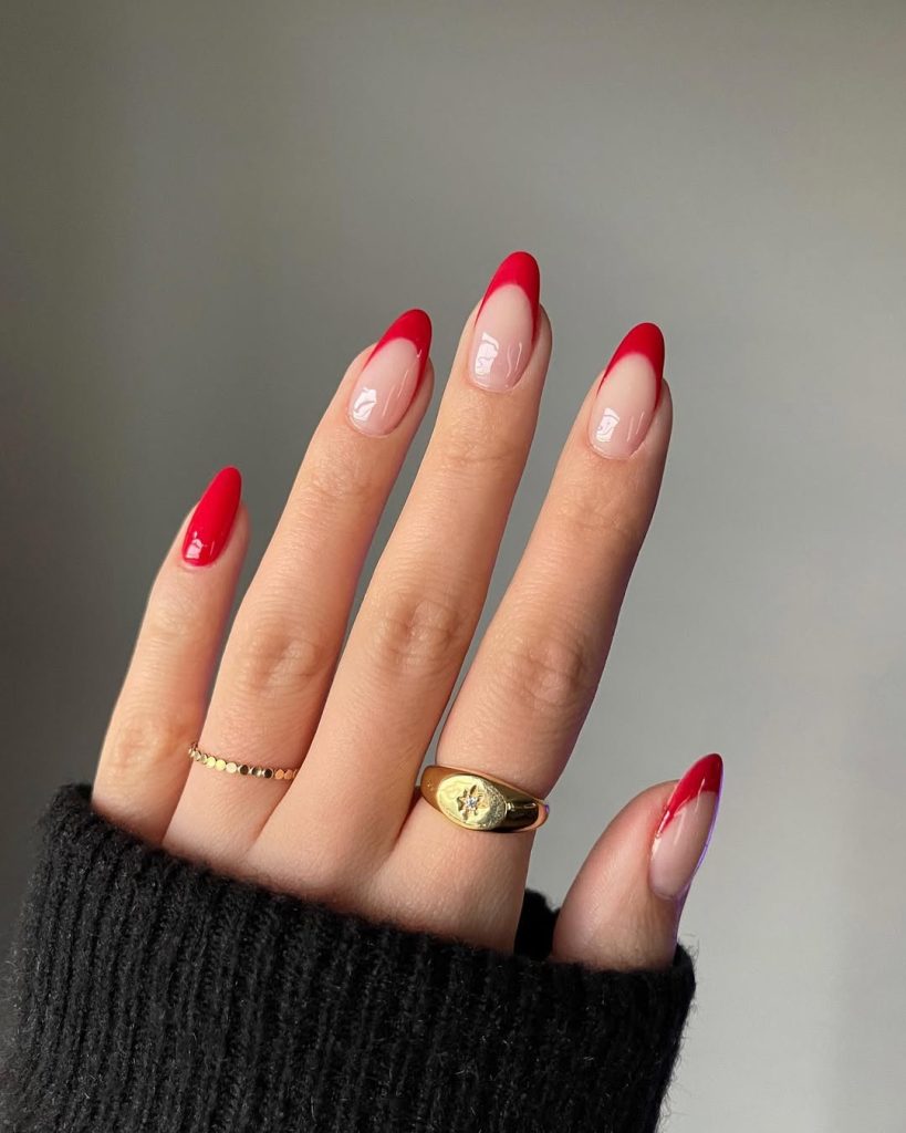 old money summer almond nails with clear base and red French tips, one full red nail accent

