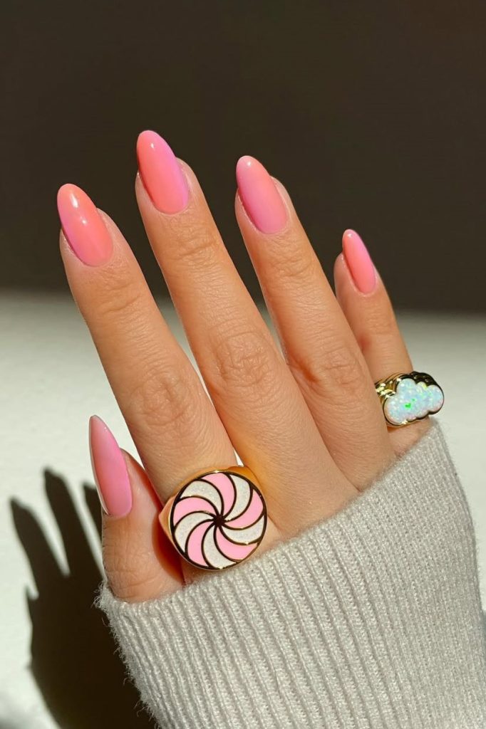 Classy June nails with almond shape featuring pink to peach ombré gradient
