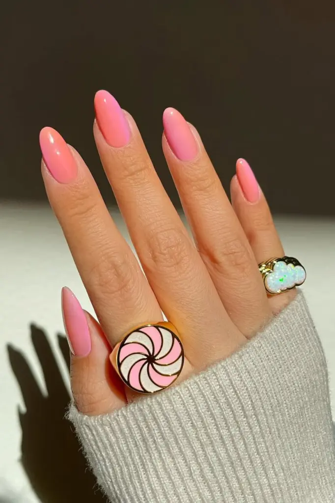 Classy June nails with almond shape featuring pink to peach ombré gradient
