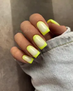Square neon yellow French tip nails with milky base and glitter cuticle for vibrant summer style