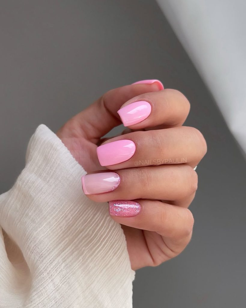 Classy June nails with square shape featuring solid pink polish, milky pink with French tips  and glitter accent