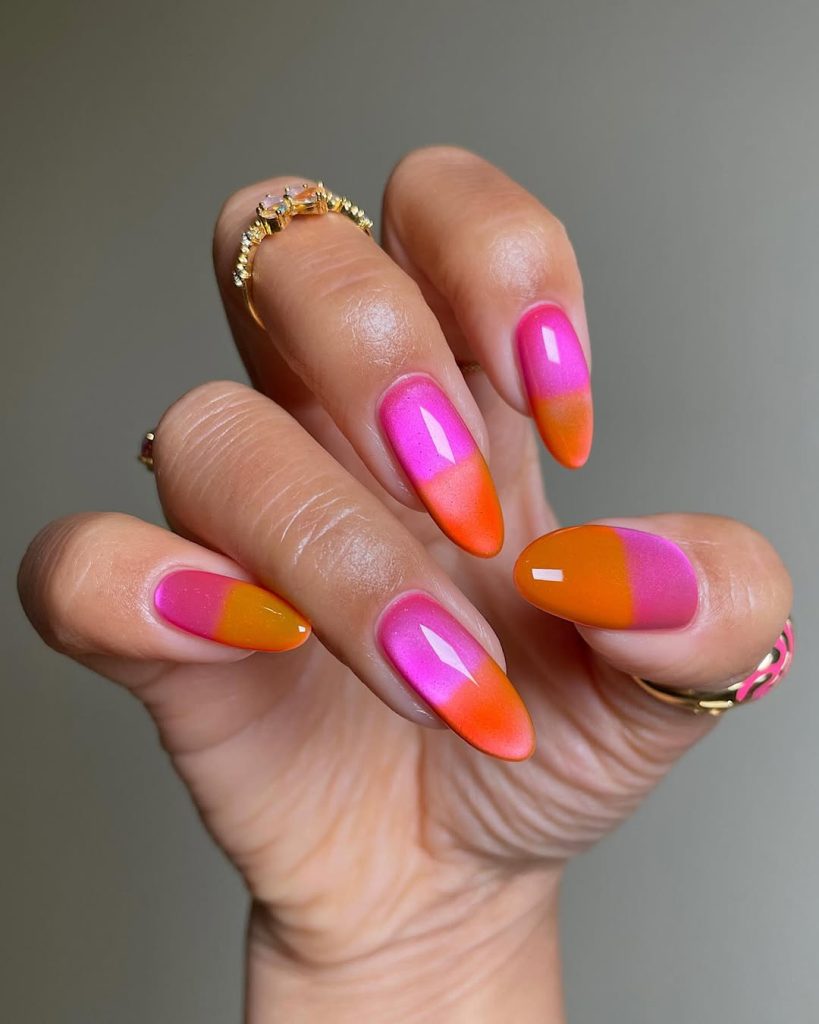 Long almond neon ombré nails with magnetic cat eye effect in hot pink and orange
