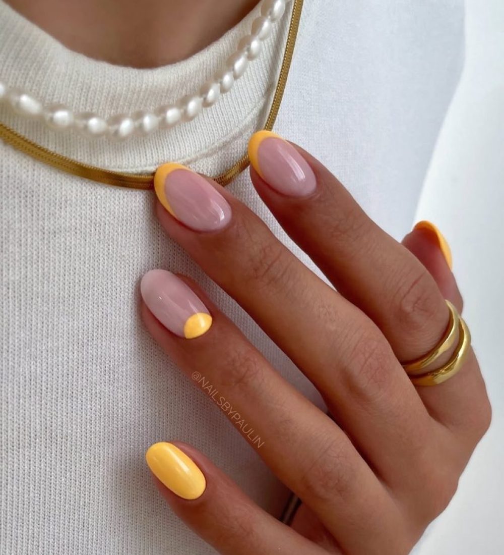 Classy short summer nails with milky base and bright yellow French tips and accent nail