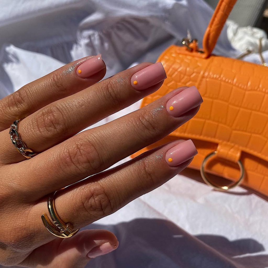 old money summer short square nails with dusty rose polish and small orange dot accents near cuticles