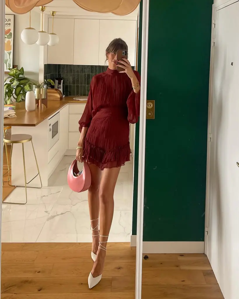 Romantic summer date night outfit with burgundy pleated mini dress, balloon sleeves, white lace-up pointed heels and pink statement handbag