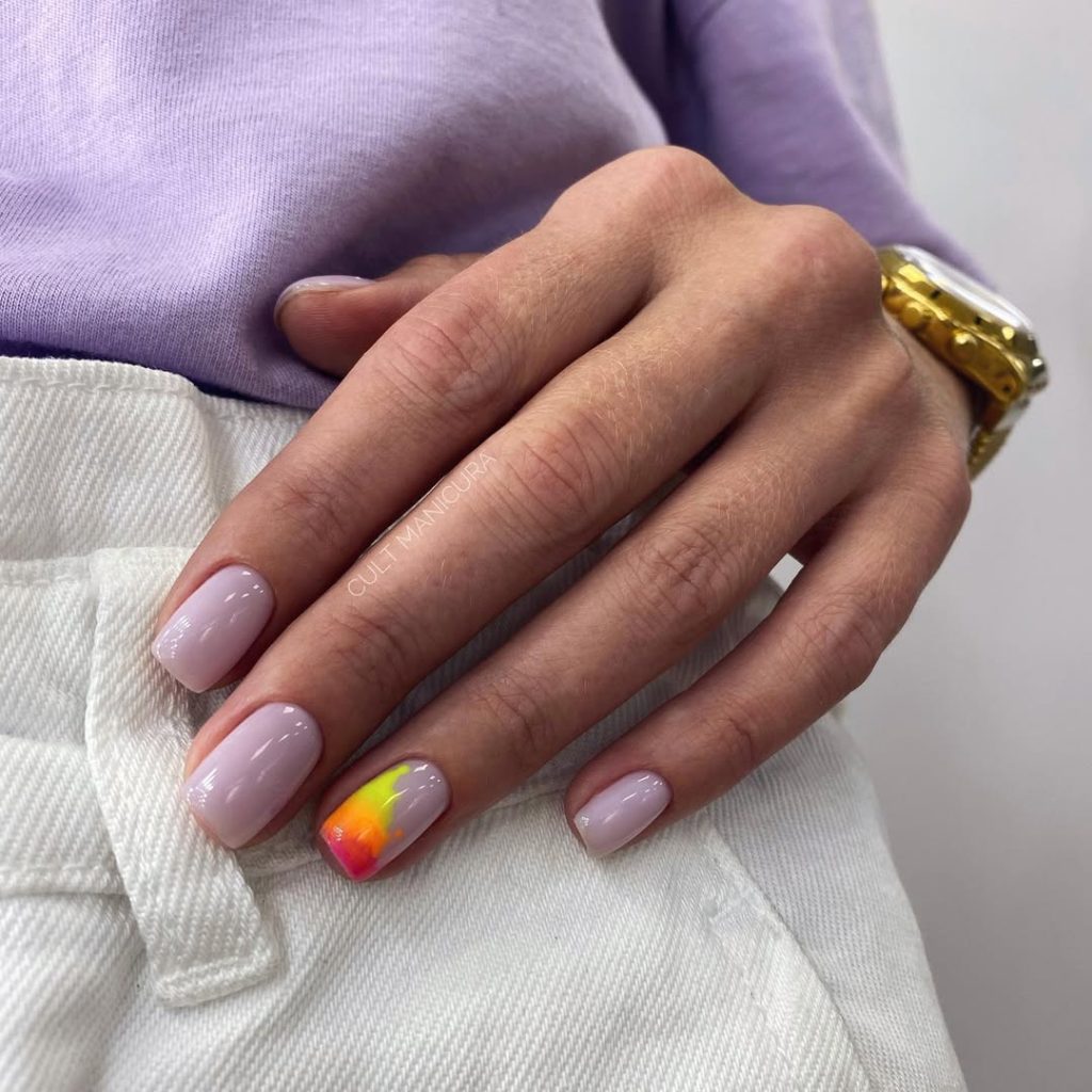 Short simple milky nails with tropical sunset accent on ring finger