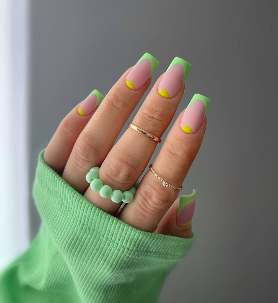 lassy square nails with green French tips, nude base and yellow smile lines creating a bright summer manicure design