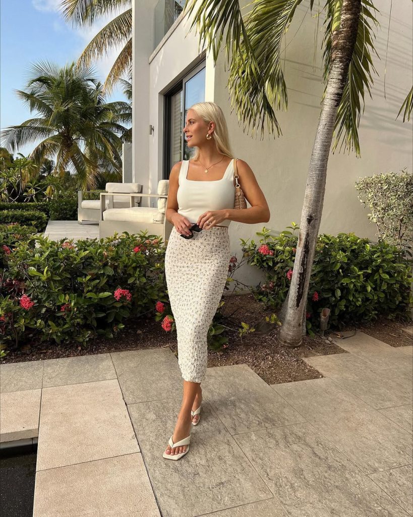 summer date night outfit with white square-neck tank top, cream textured midi skirt, white thong heels and mini woven bag
