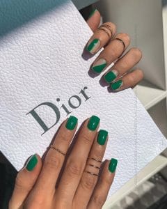 classy short summer nails with emerald green polish and nude base featuring geometric color block pattern