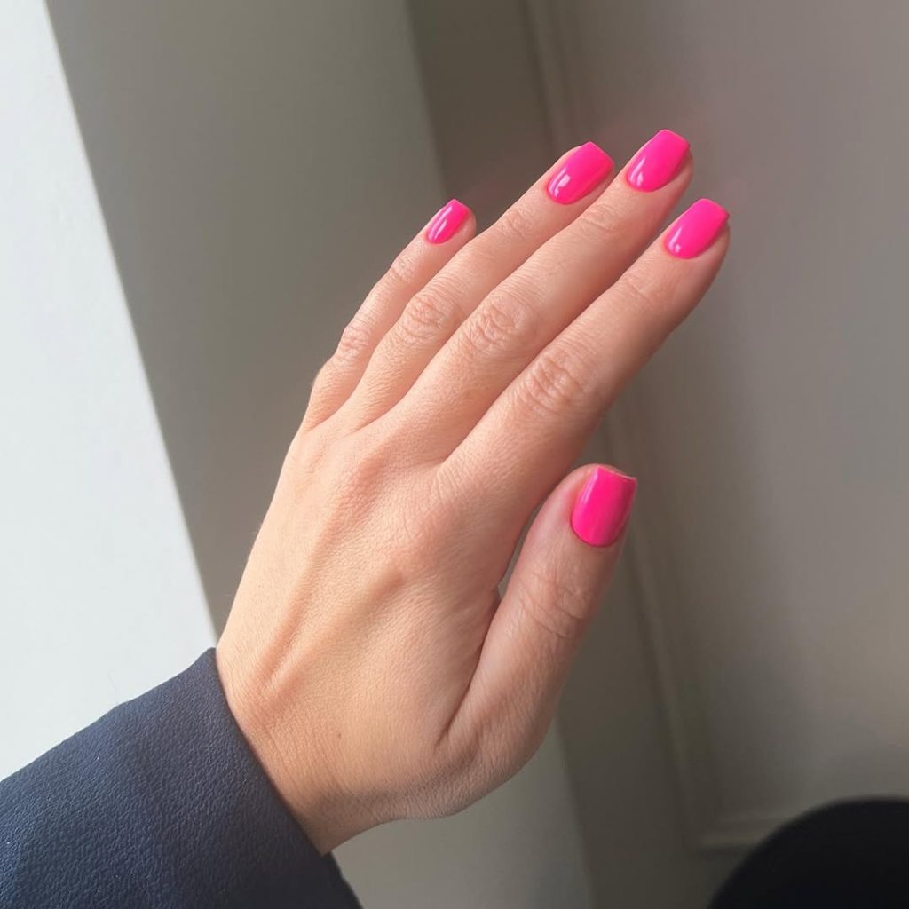 Short classy square nails in vibrant hot pink