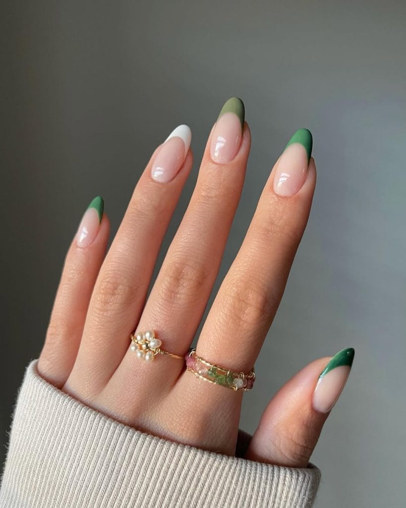 Long almond fall nails with nude base and green French tips