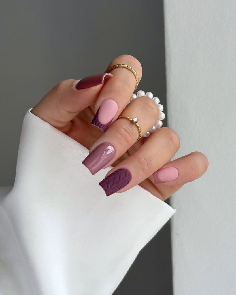 Long fall nails with soft pink base and deep plum cable knit texture accent nails
