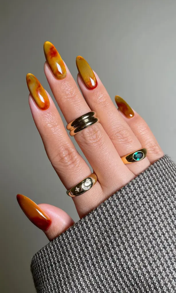 Long almond fall nails with yellow to orange gradient design