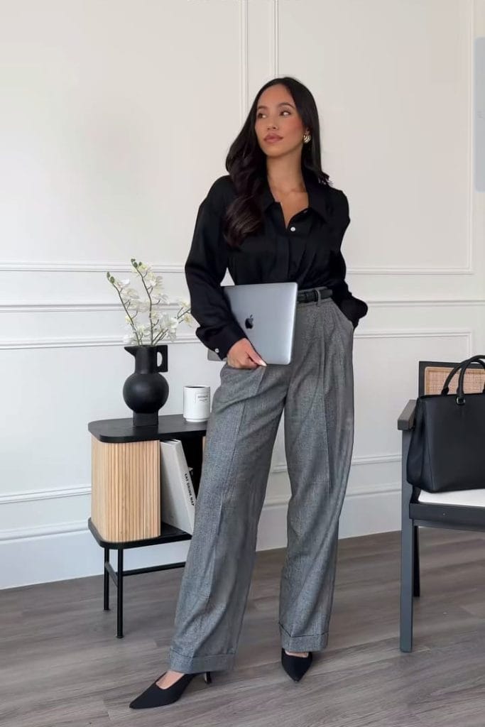 Corporate fall outfit with black shirt, grey wide-leg trousers and black pumps