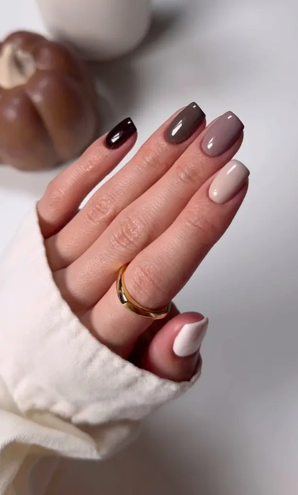 Simple squoval fall nails with neutral ombré gradient from dark chocolate brown to nude and creamy white
