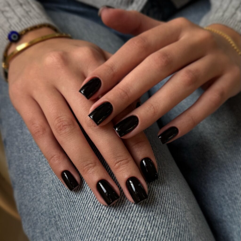 Old money fall nails with glossy black polish and square tips.
