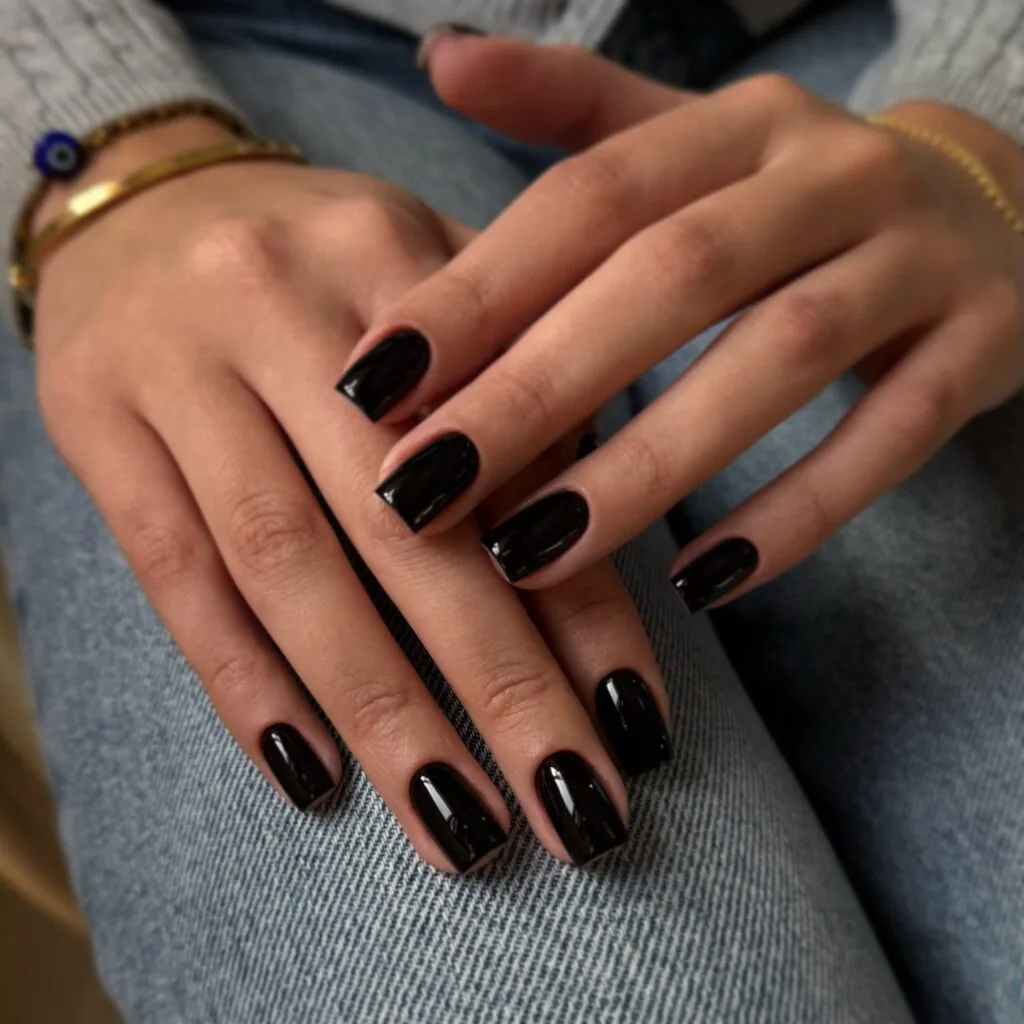 Old money fall nails with glossy black polish and square tips.