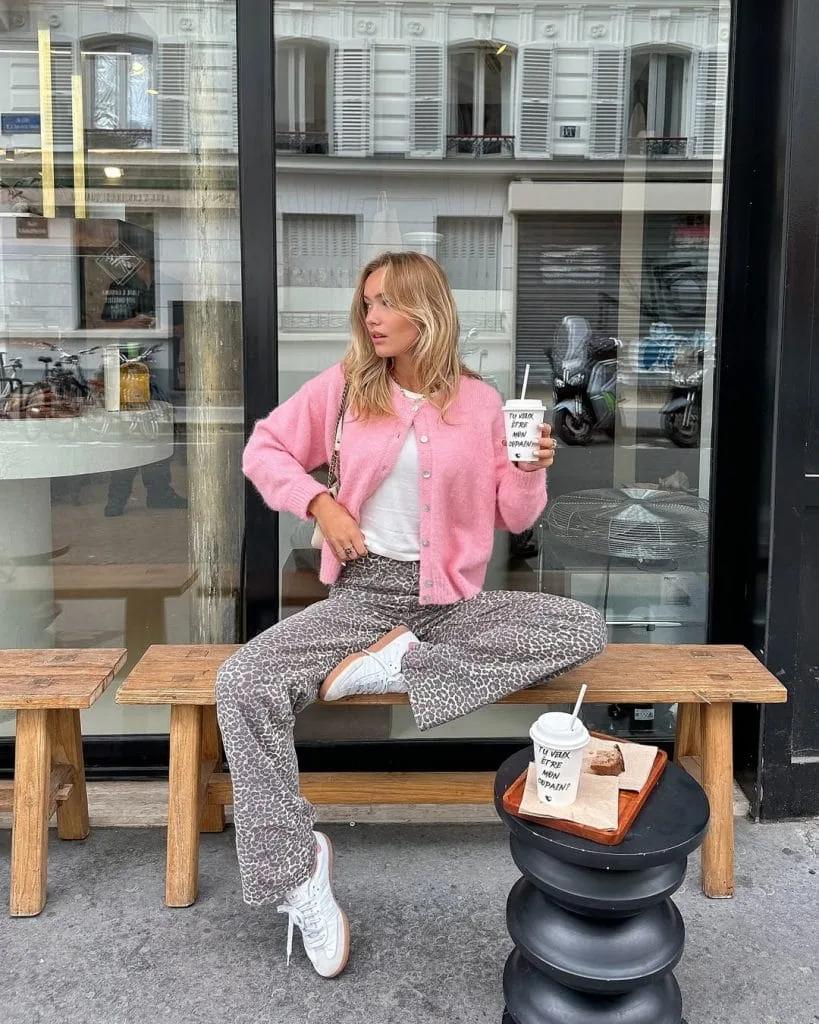 Casual fall outfit with pink cardigan, white t-shirt, leopard print pants, white sneakers