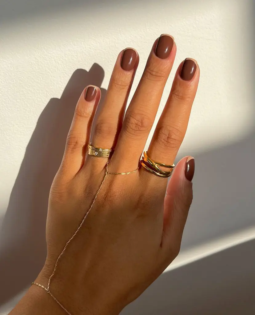 Short fall nails in espresso brown with beige French tips and glossy finish