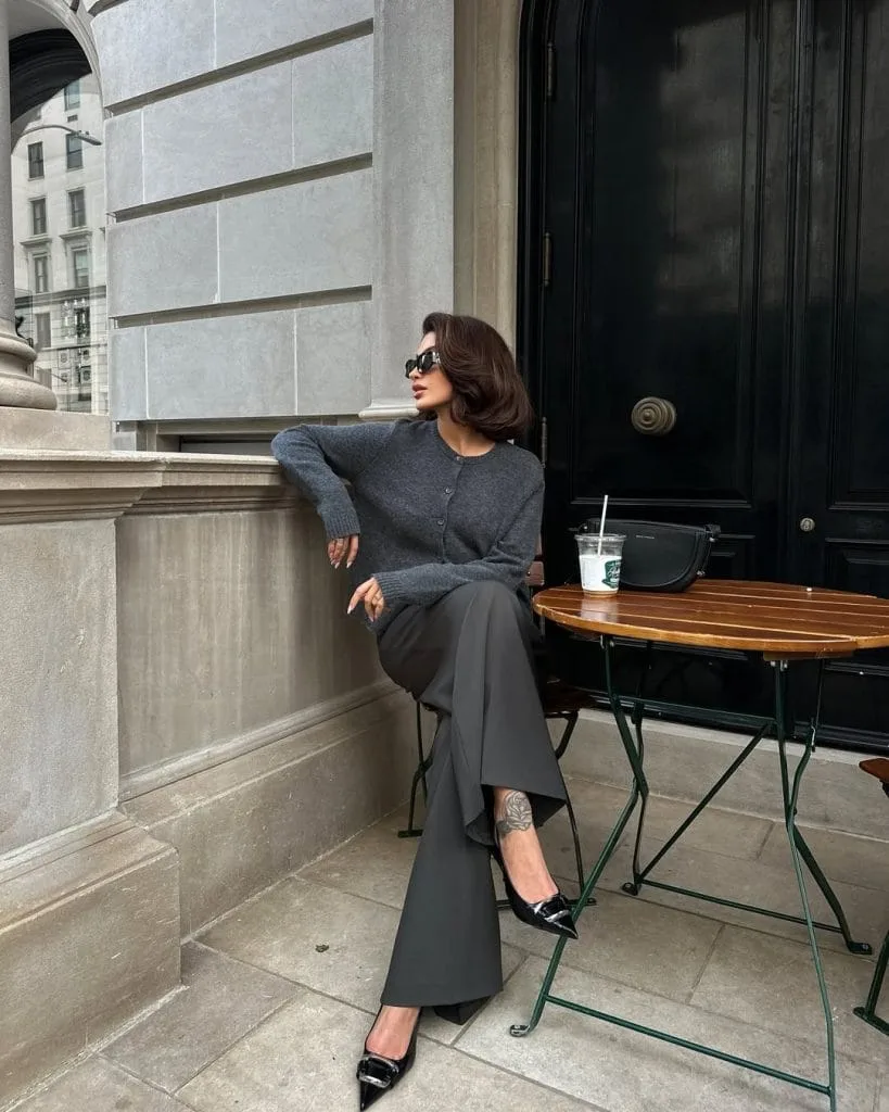 Elegant old money outfit with grey cardigan, matching wide-leg trousers and black pumps