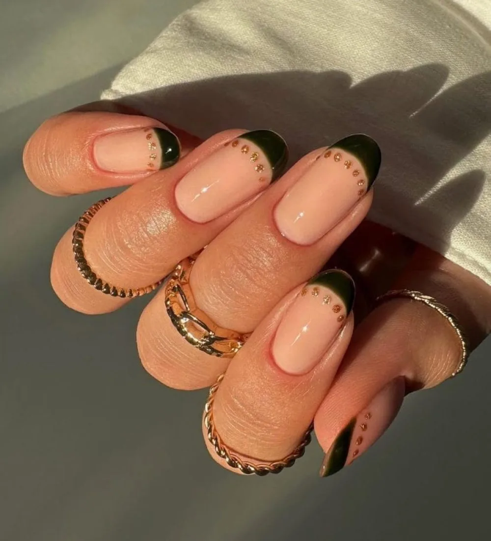 Classy fall nails with green French tips and gold dots