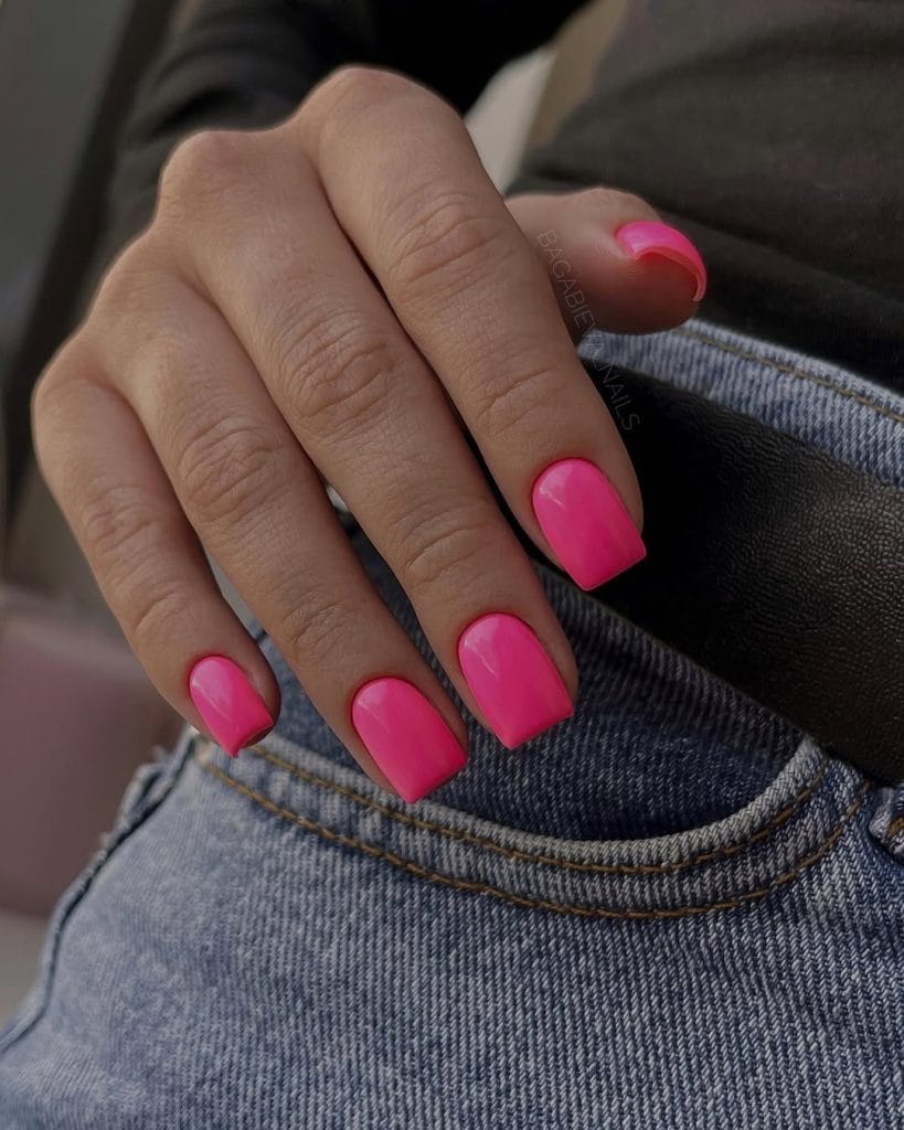 Short square August nails with bright hot pink polish