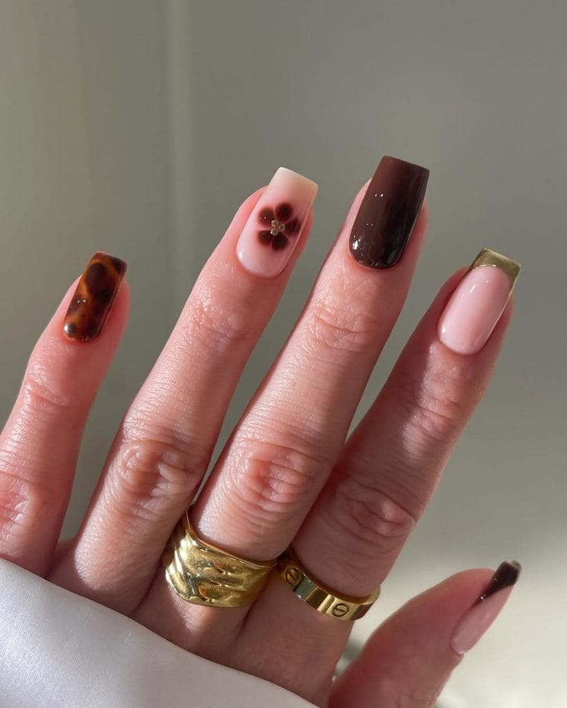 Mixed autumn nail designs with tortoiseshell, brown polish, and French tips