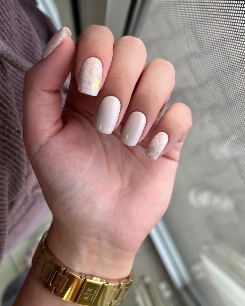 Cream fall nails with marble design and gold accents