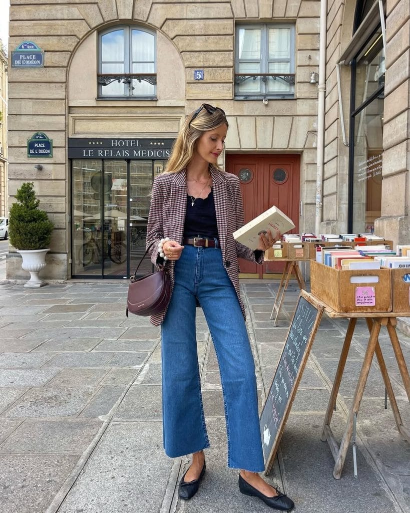 Parisian fall outfit with burgundy check blazer, wide-leg jeans, black ballet flats