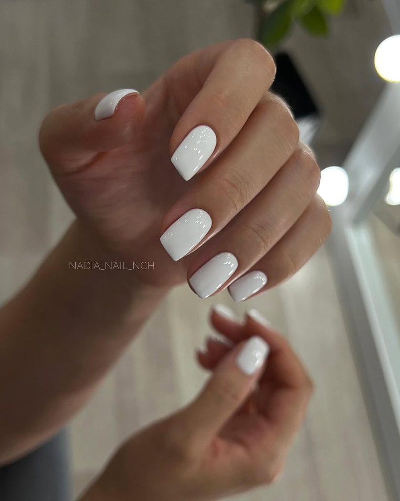 short square August nails with clean white polish and glossy finish