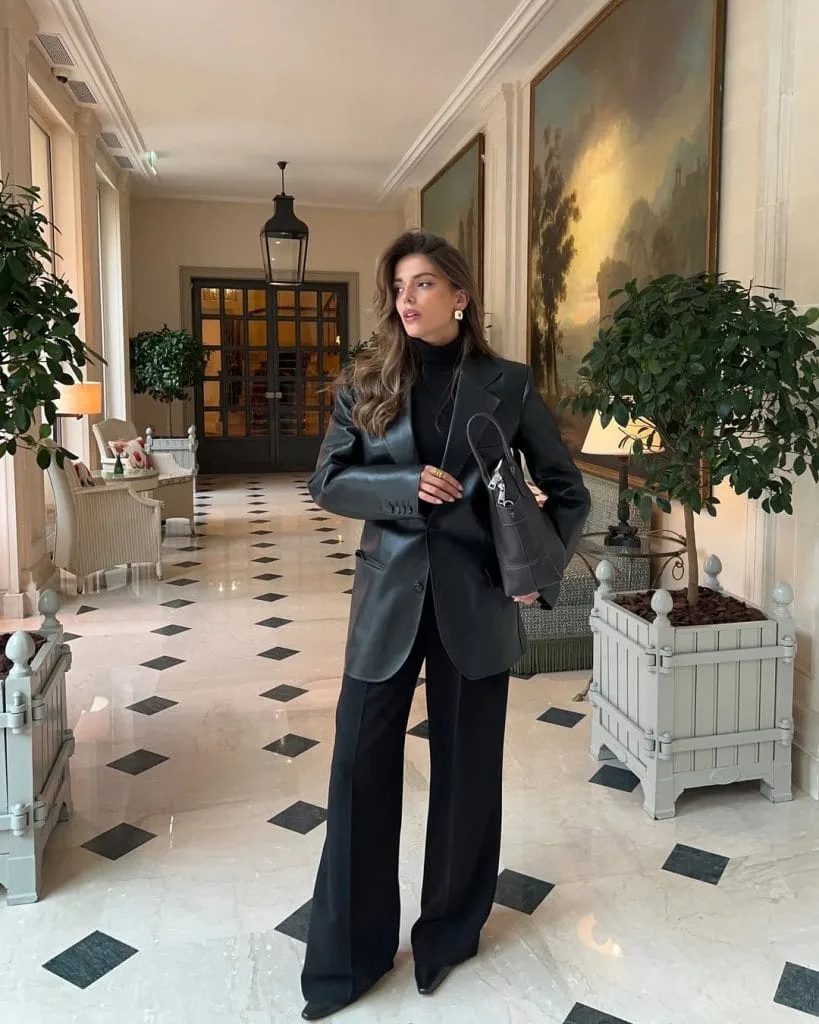Elegant old money outfit with black oversized blazer, wide-leg trousers and turtleneck