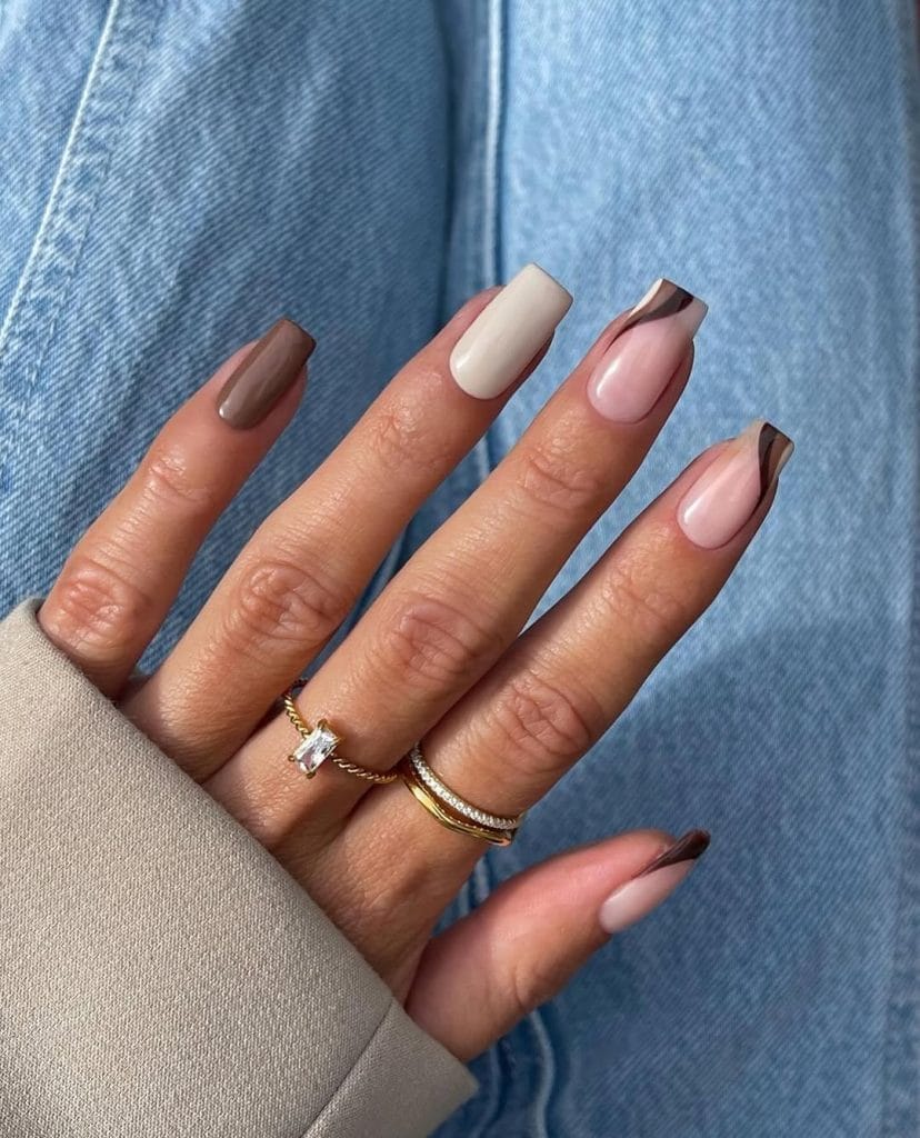 Fall nails with brown and cream swirl designs
