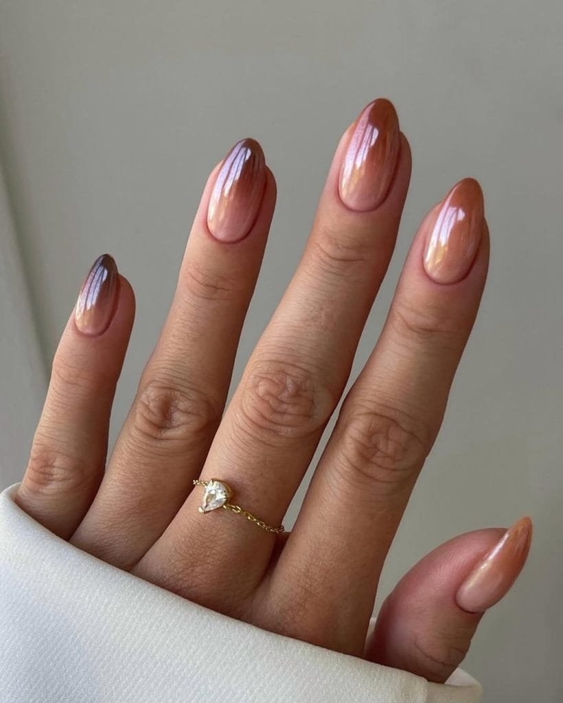 Long almond old money fall nails with nude to brown ombre chrome finish