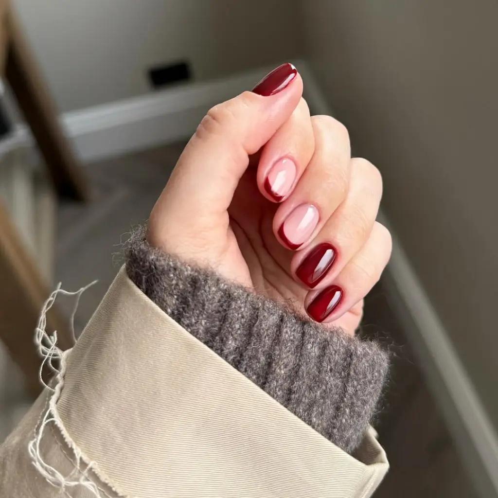 simple fall short nails alternating between burgundy polish and pink French tips
