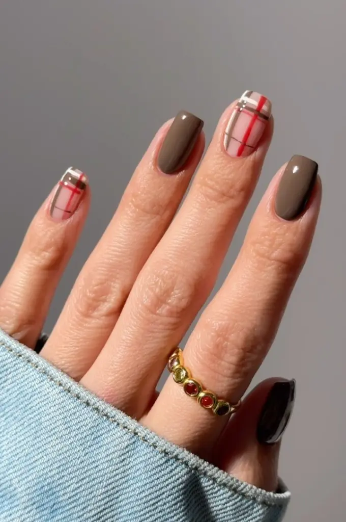 Short fall nails with taupe and plaid pattern design in red and beige colors