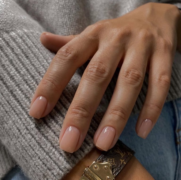 Soft beige neutral nails on square shape with glossy finish