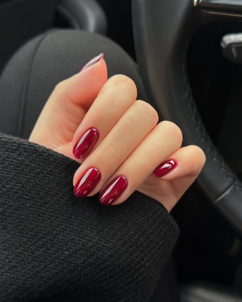 Short deep red old money fall nails with glossy finish
