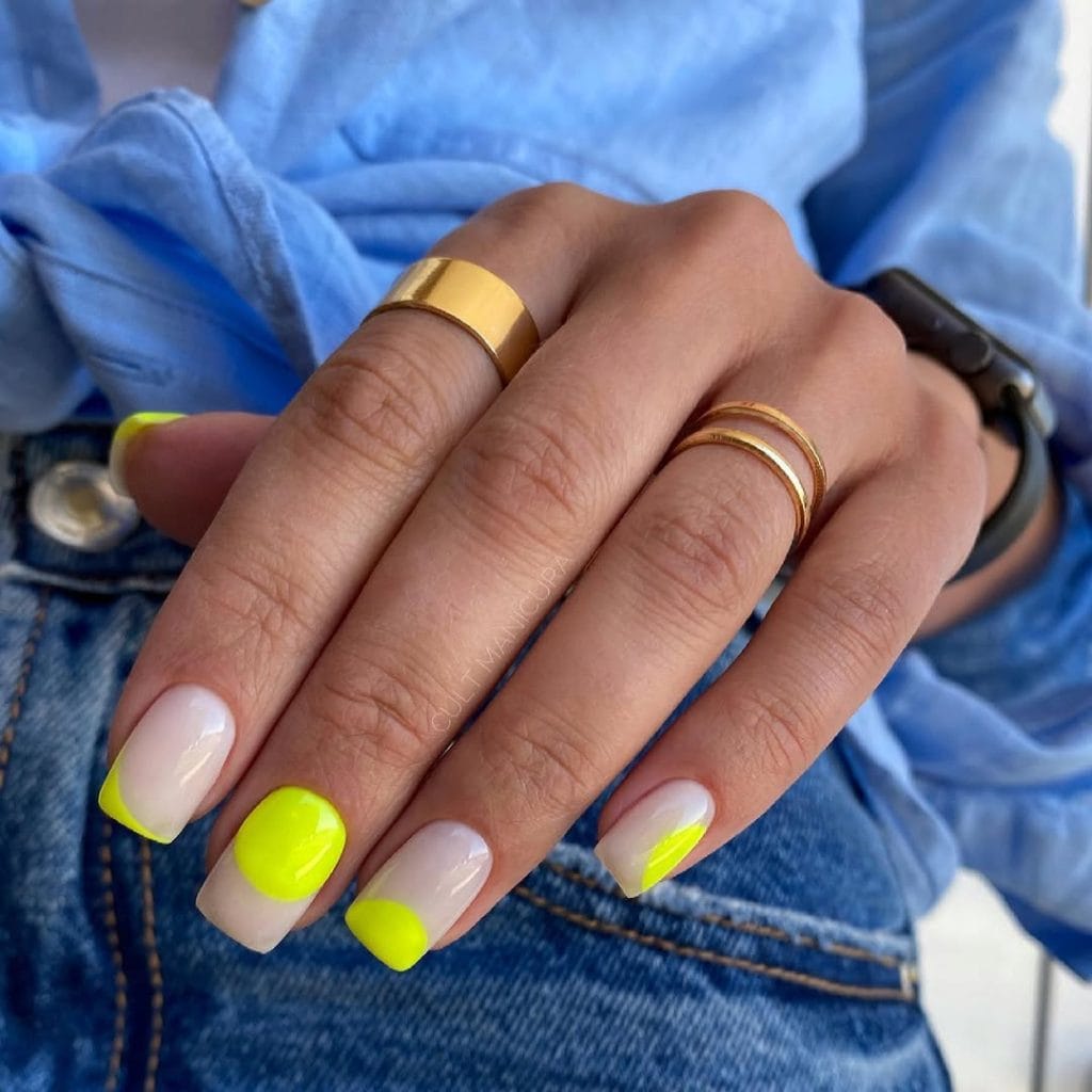 Short square August nails with milky white base and bright neon yellow accent shapes