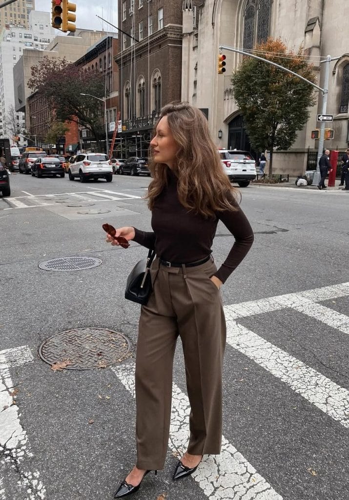 Fall office outfit with brown turtleneck, taupe straight-leg pants and black kitten heels