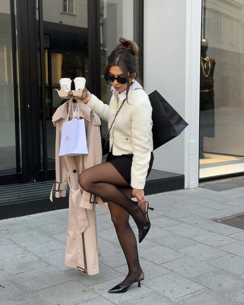 Chic old money outfit with tweed cardigan, white shirt, black mini skirt and slingback pumps